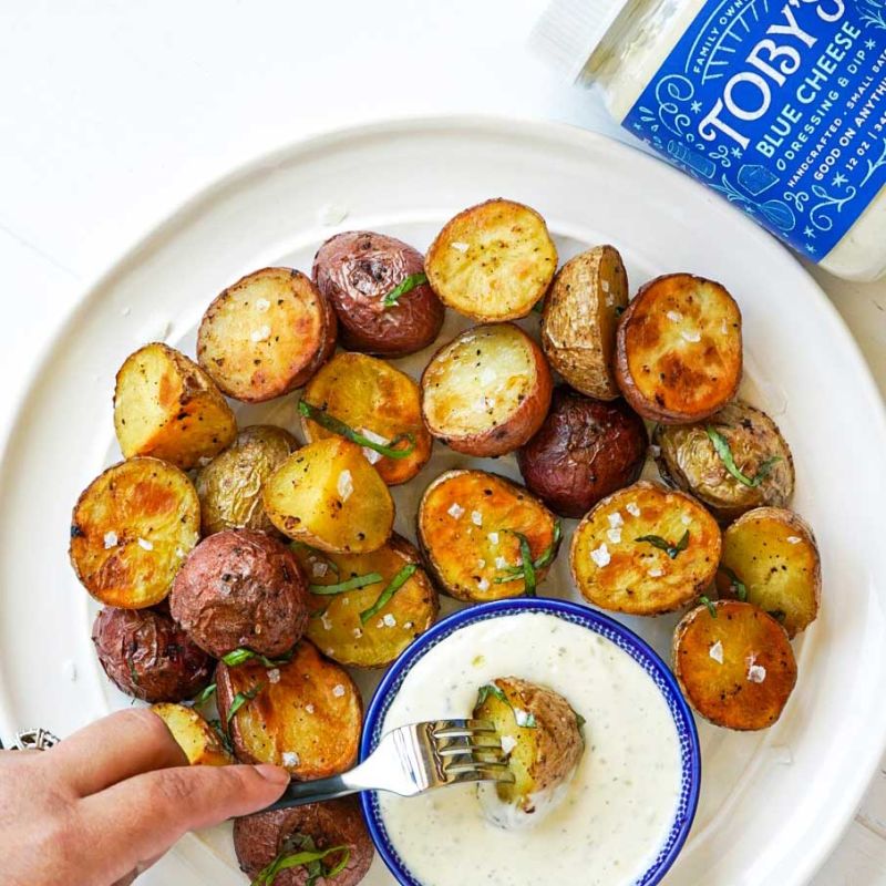 roasted potatoes dipped in Toby's Blue Cheese Dressing & Dip